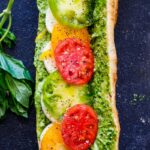 These Caprese Sandwiches are the perfect summer lunch- made with juicy ripe tomatoes, fresh mozzarella cheese, fresh basil, and  pest0-mayo on a baguette, they are great made ahead or packed for picnic lunches on the go. 