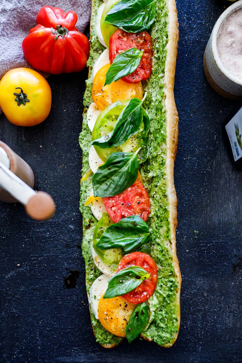 These Caprese Sandwiches are the perfect summer lunch- made with juicy ripe tomatoes, fresh mozzarella cheese, fresh basil, and pest0-mayo on a baguette, they are great made ahead or packed for picnic lunches on the go.