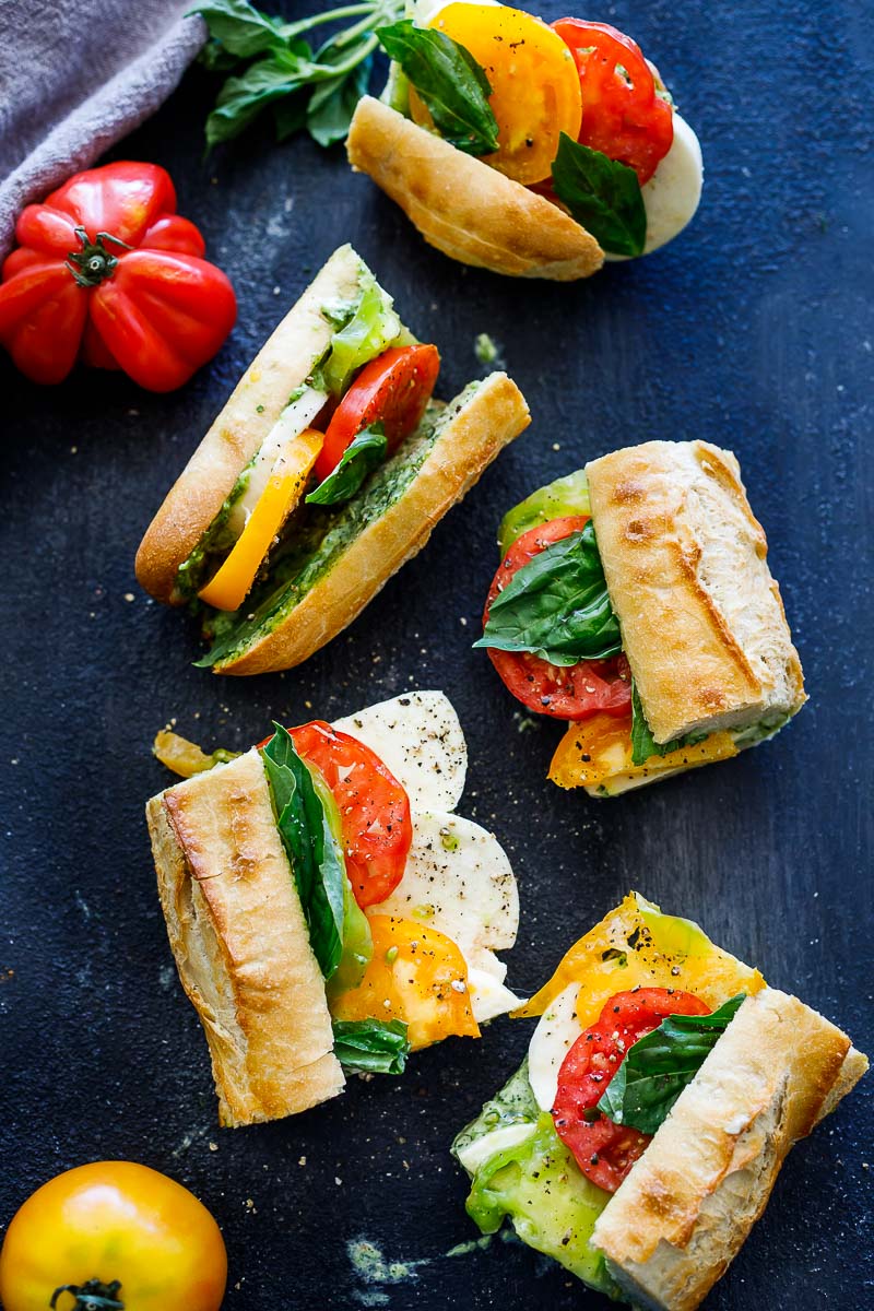 These Caprese Sandwiches are the perfect summer lunch- made with juicy ripe tomatoes, fresh mozzarella cheese, fresh basil, and  pest0-mayo on a baguette, they are great made ahead or packed for picnic lunches on the go. 