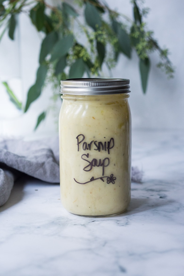 Parsnip Soup with hazelnuts, cardamom and thyme. A simple soup that can be made on the stovetop or roasted in the oven. Vegan Adaptable. #parsnipsoup #parsniprecipes #parsnips