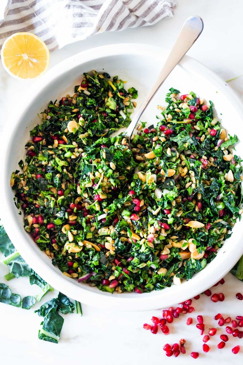 Kale Farro Salad with Almonds and Pomegranate Seeds. Think of this like a Winter Tabbouleh- lemony light and flavorful, this easy Middle Eastern-inspired salad can be made ahead, perfect for mid-week lunches. Vegan and Healthy