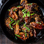 Crispy Korean Chicken Wings with Korean Gochujang Sauce! These crispy wings are extra crispy, spicy and full of flavor! #wings #chickenwings #koreanchickenwings #superbowl #suberbowlrecipes #gochujang