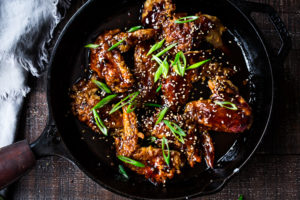 Crispy Korean Chicken Wings with Korean Gochujang Sauce! These crispy wings are extra crispy, spicy and full of flavor! #wings #chickenwings #koreanchickenwings #superbowl #suberbowlrecipes #gochujang