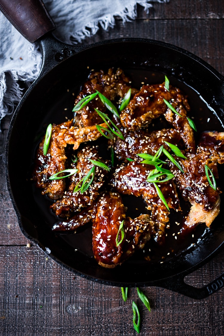 Crispy Korean Chicken Wings with Korean Gochujang Sauce! These crispy wings are extra crispy, spicy and full of flavor! #wings #chickenwings #koreanchickenwings #superbowl #suberbowlrecipes #gochujang