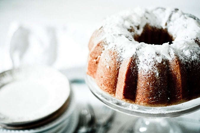 An EASY recipe for the most delicious VEGAN Lemon Coconut Bundt Cake...use meyer lemons for extra goodness. One bowl, simple! 