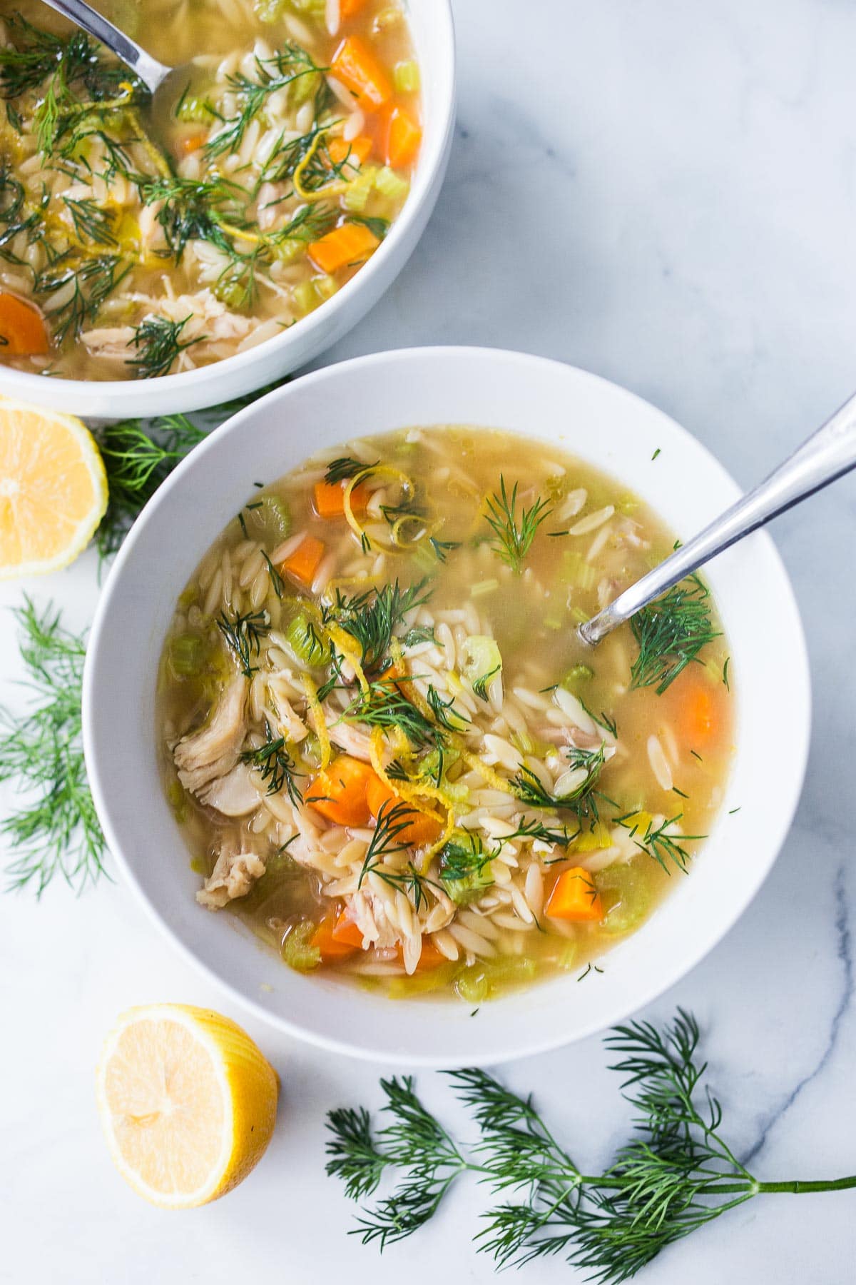 This Chicken Orzo Soup is enhanced with lemon, coriander and dill. Bright and springy, this soup is tangy, light and delicious! 