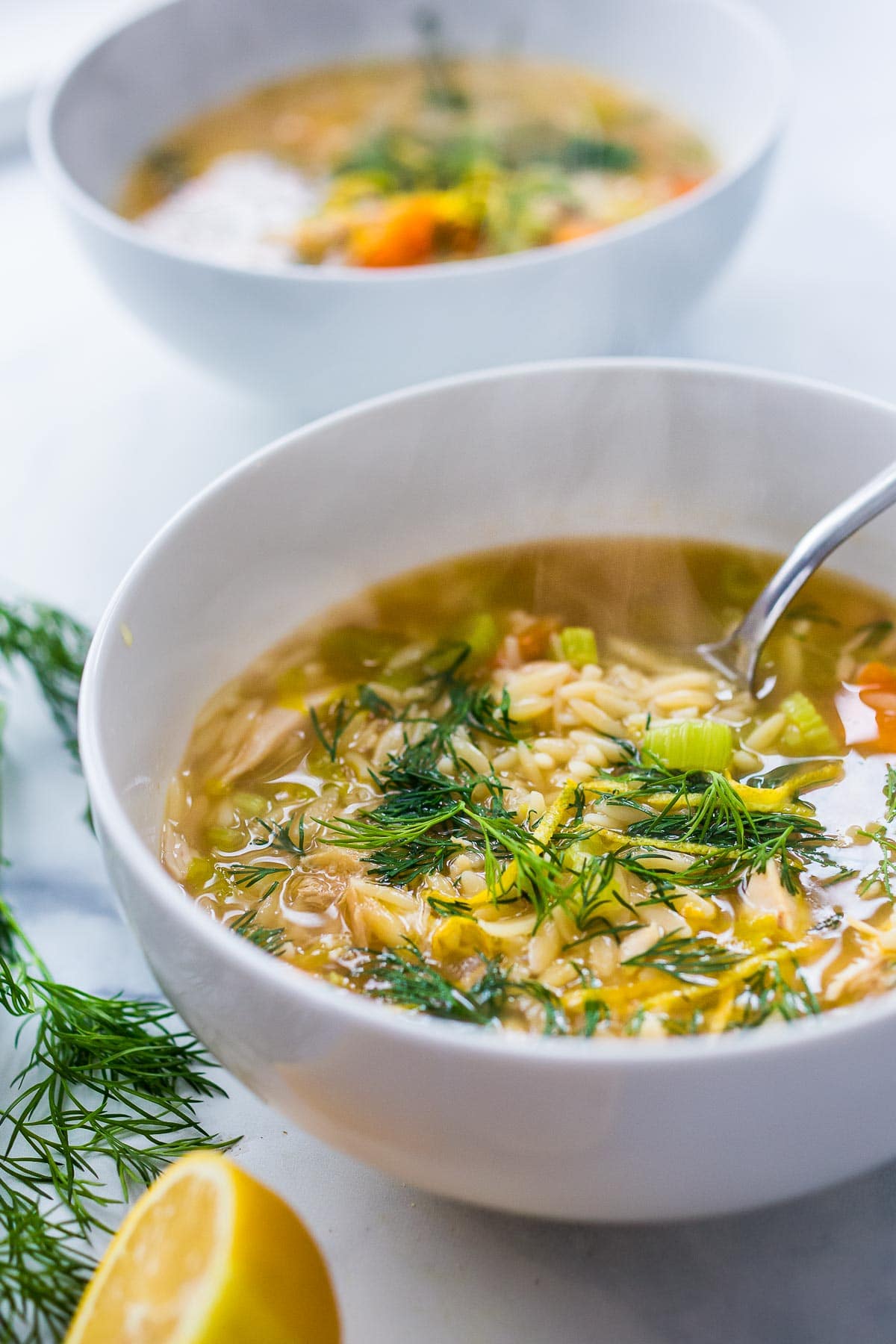 This Chicken Orzo Soup is enhanced with lemon, coriander and dill. Bright and springy, this soup is tangy, light and delicious! 
