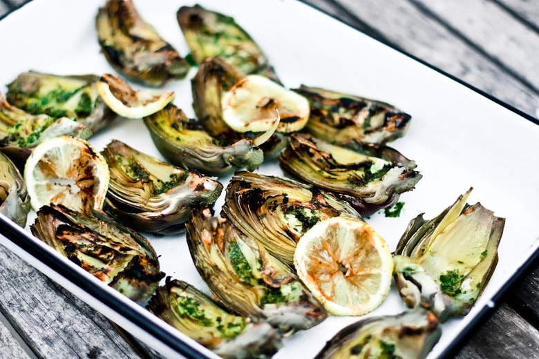 Grilled Artichokes with vegan adaptable Basil Aioli and herb oil - a delicious way to serve artichokes!
