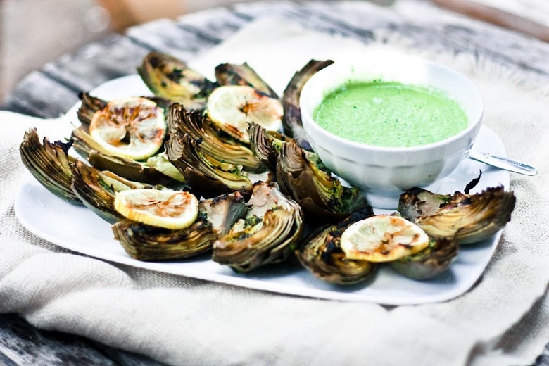 Grilled Artichokes with vegan adaptable Basil Aioli and herb oil - a delicious way to serve artichokes!