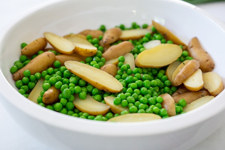 slice potatoes in half and place in bowl