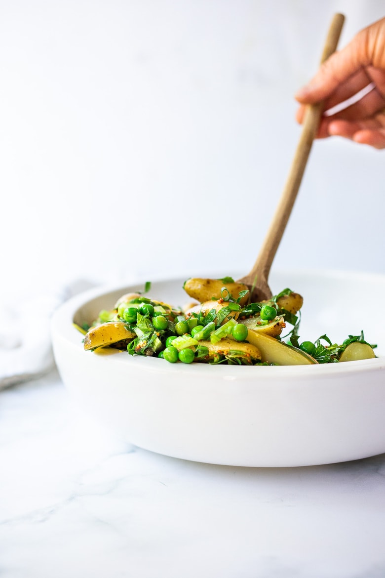 Potato Pea Salad with an herby Tarragon dressing. This zesty, vegan potato salad is loaded with fresh herbs and flavor!  A delicious, healthy salad that can be made ahead. #potatosalad