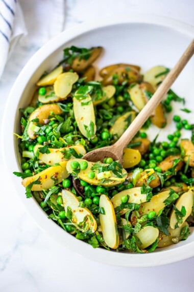 Potato Pea Salad with an herby Tarragon dressing. This zesty, vegan potato salad is loaded with fresh herbs and flavor!  A delicious, healthy salad that can be made ahead. #potatosalad