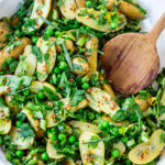 Potato Pea Salad with an herby Tarragon dressing. This zesty, vegan potato salad is loaded with fresh herbs and flavor! A delicious, healthy salad that can be made ahead. #potatosalad