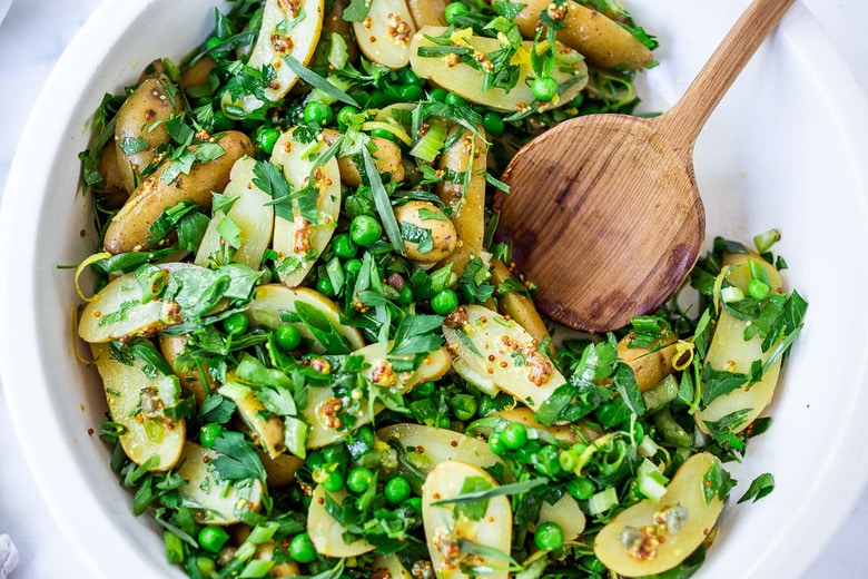 Potato Pea Salad with an herby Tarragon dressing. This zesty, vegan potato salad is loaded with fresh herbs and flavor!  A delicious, healthy salad that can be made ahead. #potatosalad