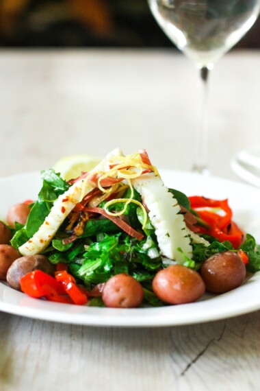 Grilled Calamari Steak Salad with Arugula, roasted peppers, steamed potatoes and Preserved Lemon Vinaigrette!