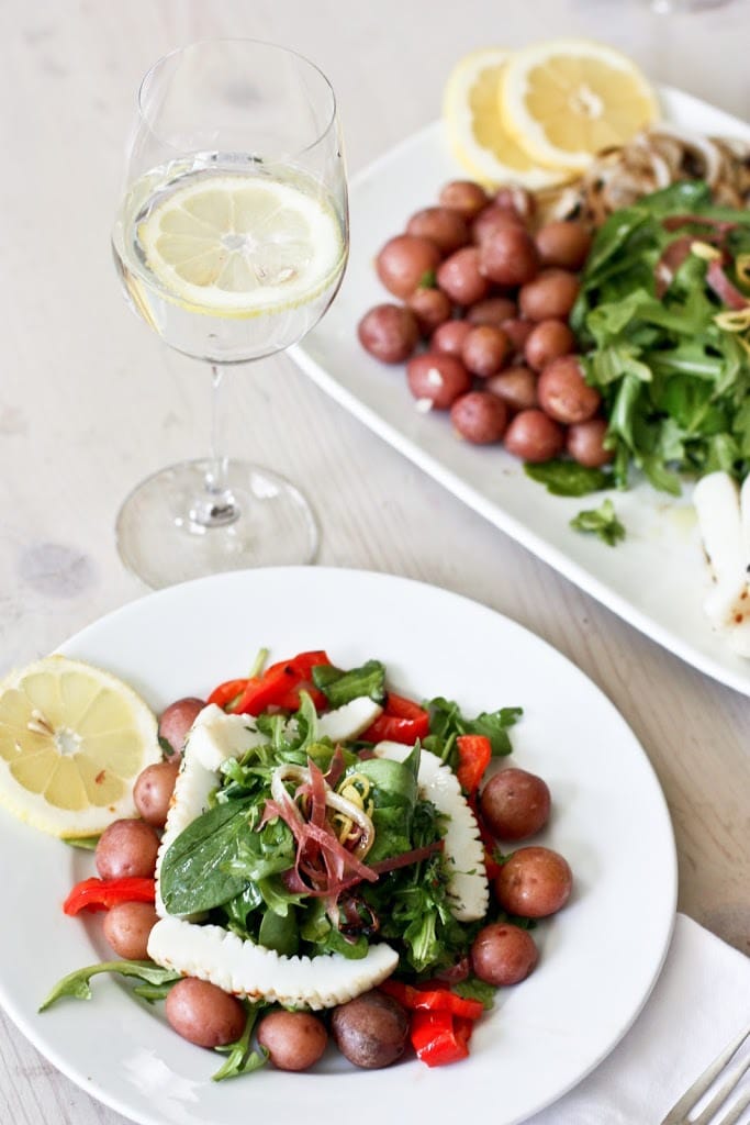 A delicious recipe for Grilled Calamari Salad with Preserved Lemon Vinaigrette with Spanish style chorizo, arugula, roasted peppers & potatoes. 