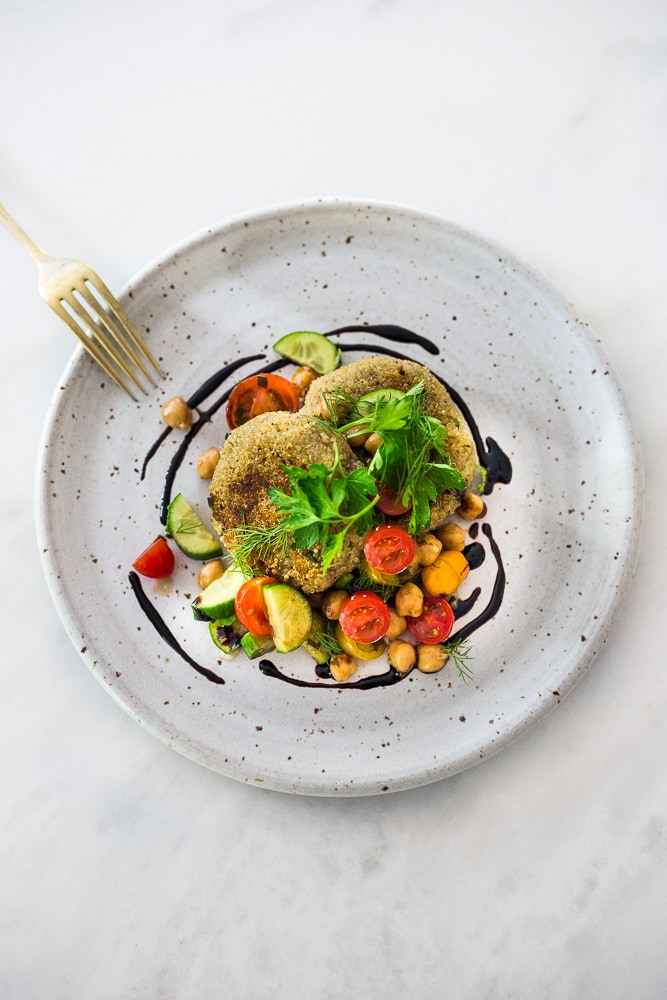 Crispy Vegan Quinoa Cakes with Tomato Chickpea Relish- a delicious, healthy flavorful vegan dinner that is gluten-free.  #quinoacakes #vegan #veganquinoa #veganquinoacakes #veganquinoarecipes #quinoapatties #glutenfree 