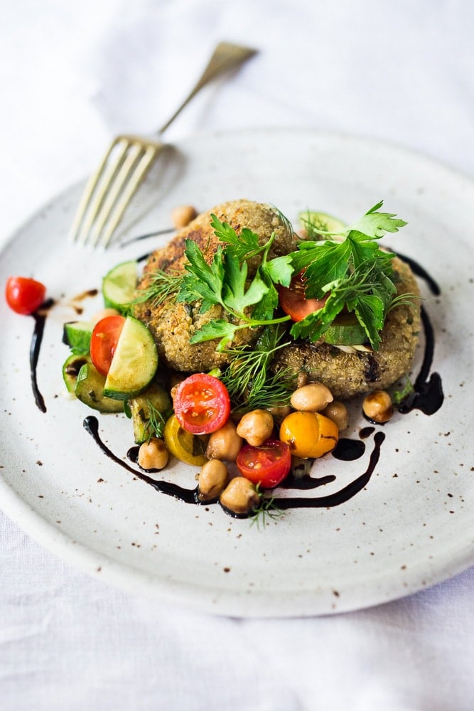 Crispy Vegan Quinoa Cakes with Tomato Chickpea Relish- a delicious, healthy flavorful vegan dinner that is gluten-free.  #quinoacakes #vegan #veganquinoa #veganquinoacakes #veganquinoarecipes #quinoapatties #glutenfree 