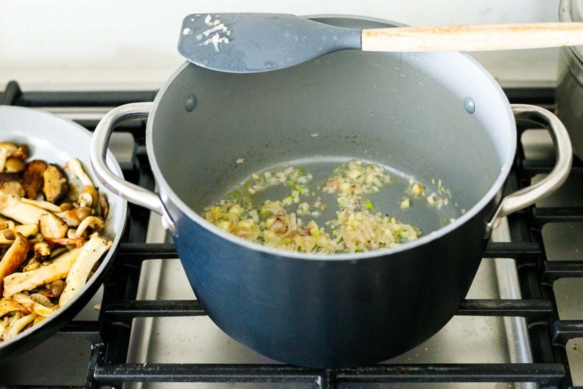 sauteeing the garlic and shallots in butter. 