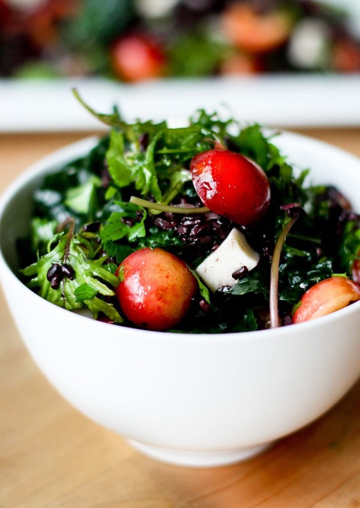 Kale Salad with fresh cherries, black rice, Haloumi and Mint! A simple summer salad that can be made ahead! #cherries #freshcherries #cherrysalad 