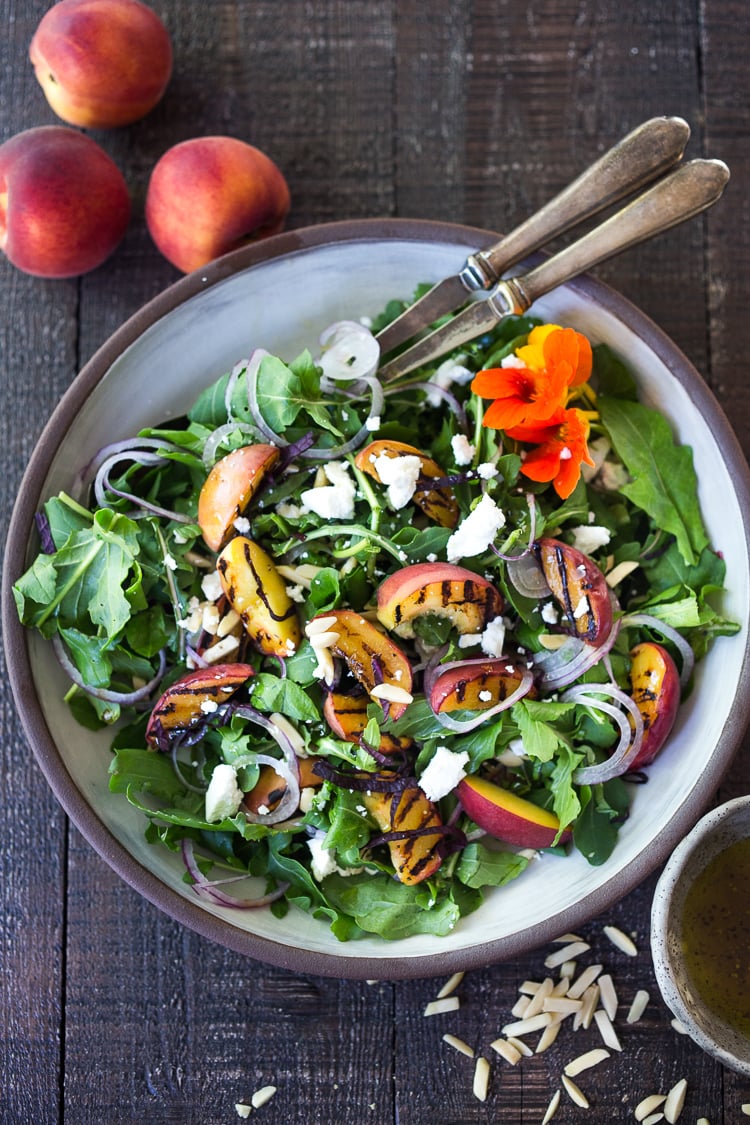 Grilled Peach and Arugula Salad with basil and a White Balsamic Vinaigrette -a simple tasty recipe using fresh seasonal peaches! #peachsalad #peaches #arugula #peacharugulasalad 