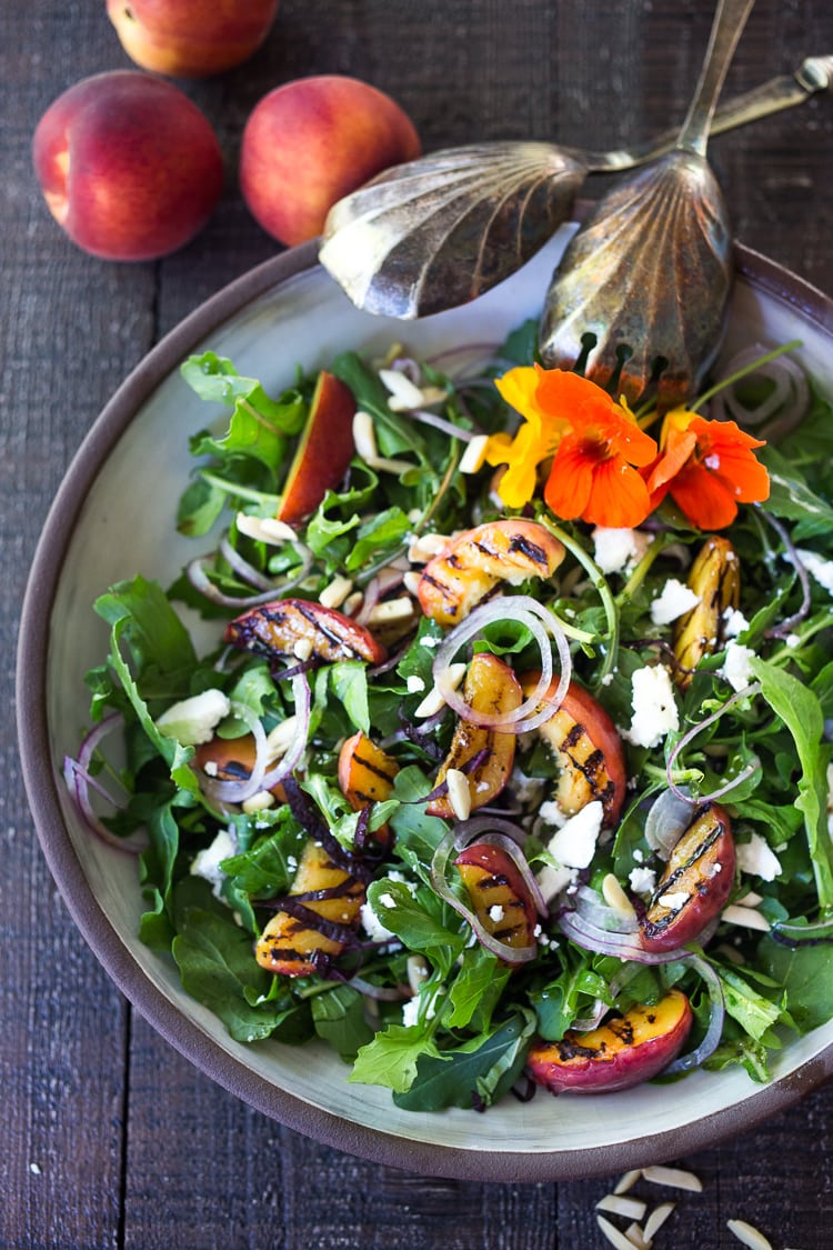 Grilled Peach and Arugula Salad with basil and a White Balsamic Vinaigrette -a simple tasty recipe using fresh seasonal peaches! #peachsalad #peaches #arugula #peacharugulasalad