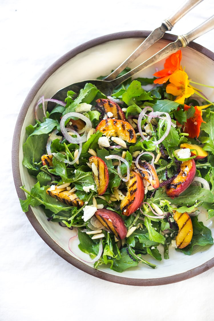 Grilled Peach and Arugula Salad with basil and a White Balsamic Vinaigrette -a simple tasty recipe using fresh seasonal peaches! #peachsalad #peaches #arugula #peacharugulasalad 