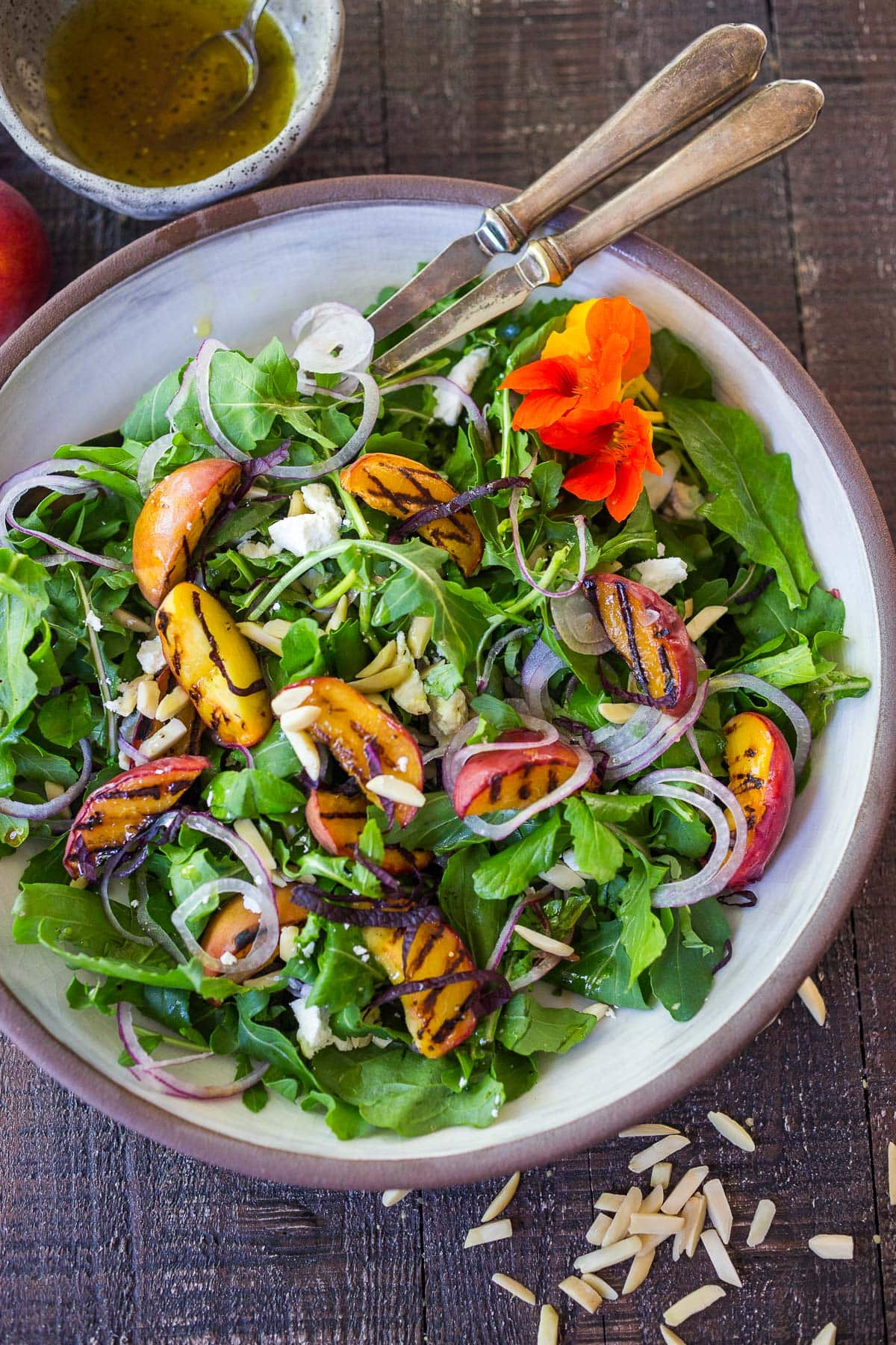 Grilled peach salad composed.