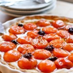This Apricot Tart is one of my favorite summer desserts. A Pate Sucree crust holds a creamy mascarpone filling topped with honey-roasted apricots infused with a whisper of star anise.