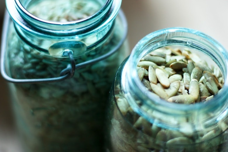 Easy Homemade Granola Recipe with clusters of nuts, seeds & coconut flakes, sweetened with Maple Syrup. 10 minutes of prep & bakes overnight. Vegan & GF!