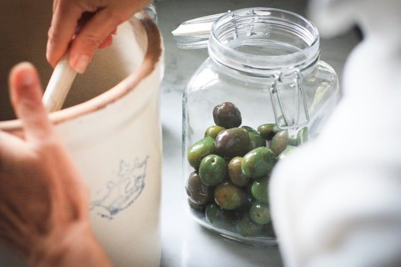 How to Cure Olives with Lye - a step by step guide, that turns bitter olives into buttery delicious bites the whole family will enjoy. #curedolives #howtocureolives #lyecuredolives