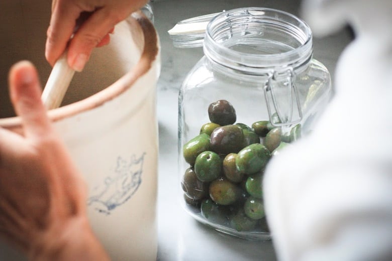 How to Cure Olives with Lye - a step by step guide, that turns bitter olives into buttery delicious bites the whole family will enjoy. #curedolives #howtocureolives #lyecuredolives 