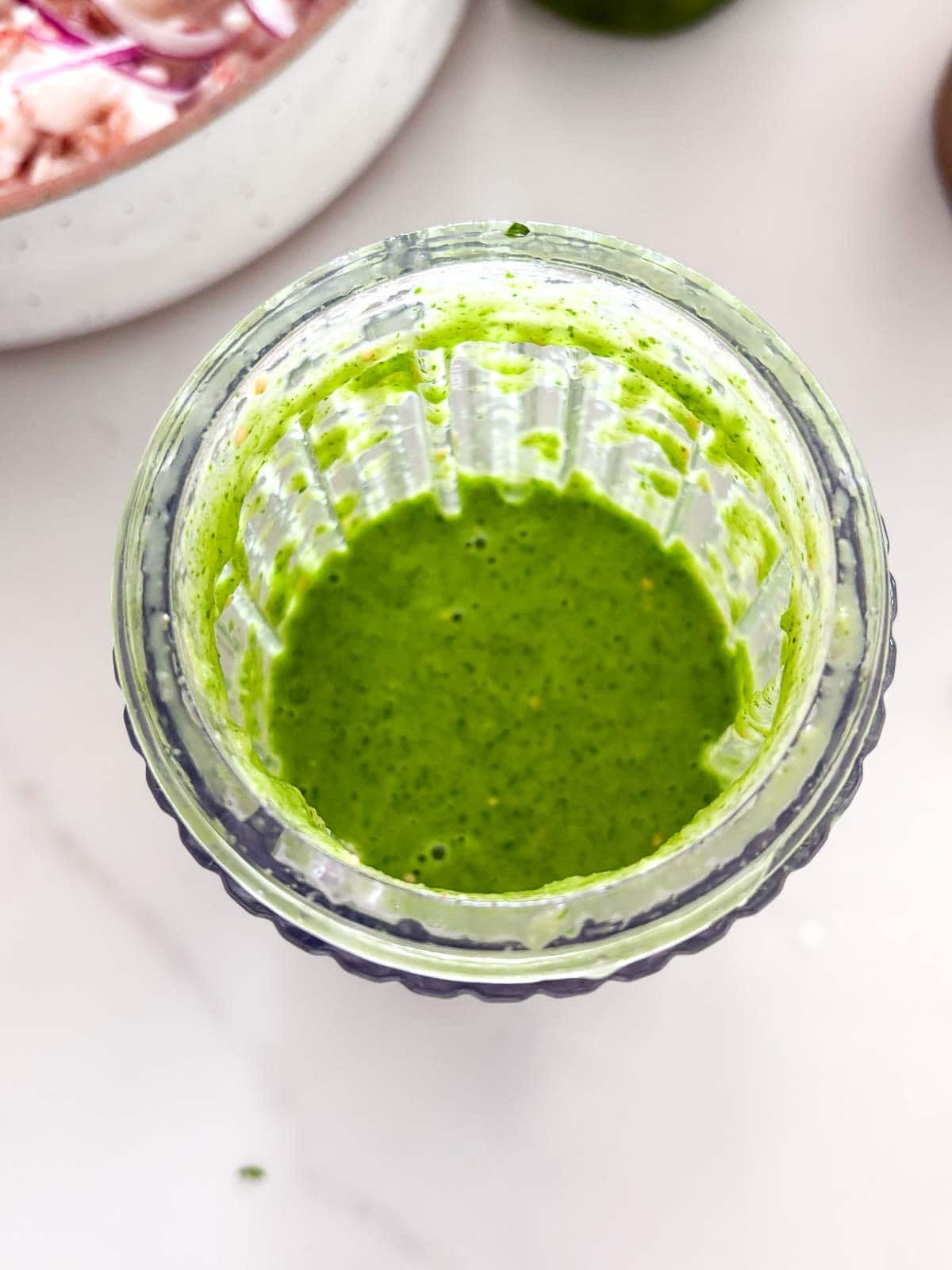 blended verde sauce in a glass jar.