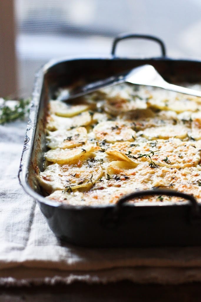 Parsnip Gratin with Gruyere and Thyme- a deliciously decadent side dish, perfect for the holiday table! | www.feastingathome.com