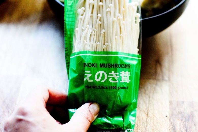 a package of enoki mushrooms 