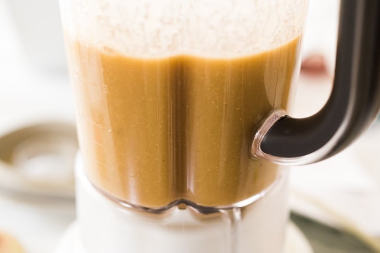 blending the vegan ramen broth to make it creamy 