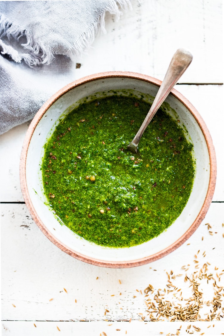 Chermoula Recipe - a bright and flavorful North African condiment that can be used to give soups, stew, fish, chicken a burst of flavor and brightness. Think of this as Middle Eastern Chimichurri Sauce! #chermoula #greensauce #chermoularecipe #moroccan