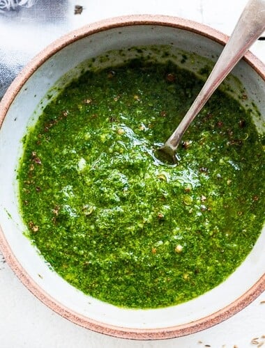 This vibrant Chermoula recipe is a classic North African herb sauce made with cilantro, parsley, garlic, lemon, and toasted spices, use as a marinade or finishing sauce.