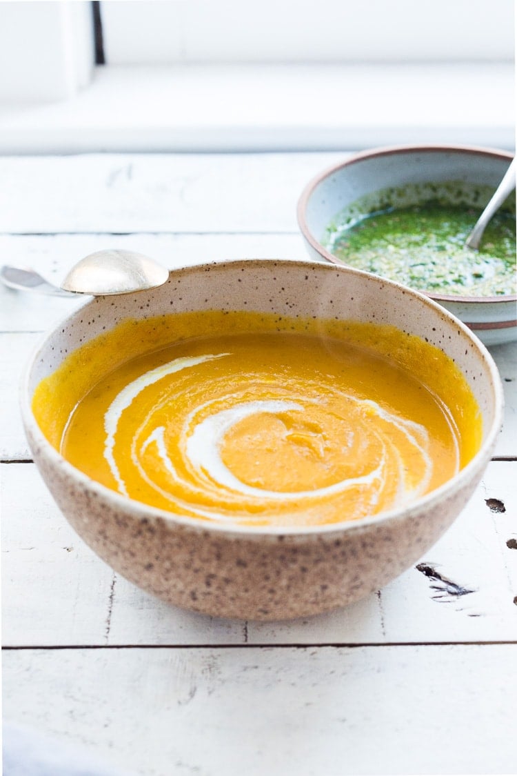 Carrot Soup with Chermoula and North African Spices - a simple healthy soup bursting with flavor. Vegan Adaptable! #carrotsoup #carrots #vegan #chermoula 