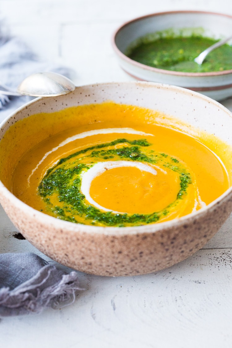 Carrot Soup with Chermoula and North African Spices - a simple healthy soup bursting with flavor. Vegan Adaptable! #carrotsoup #carrots #vegan #chermoula 
