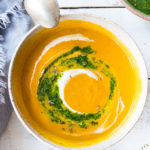 Carrot Soup with Chermoula and North African Spices - a simple healthy soup bursting with flavor. Vegan Adaptable! #carrotsoup #carrots #vegan #chermoula