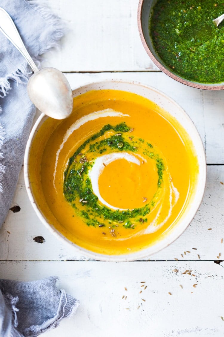 Carrot Soup with Chermoula and North African Spices - a simple healthy soup bursting with flavor. Vegan Adaptable! #carrotsoup #carrots #vegan #chermoula 