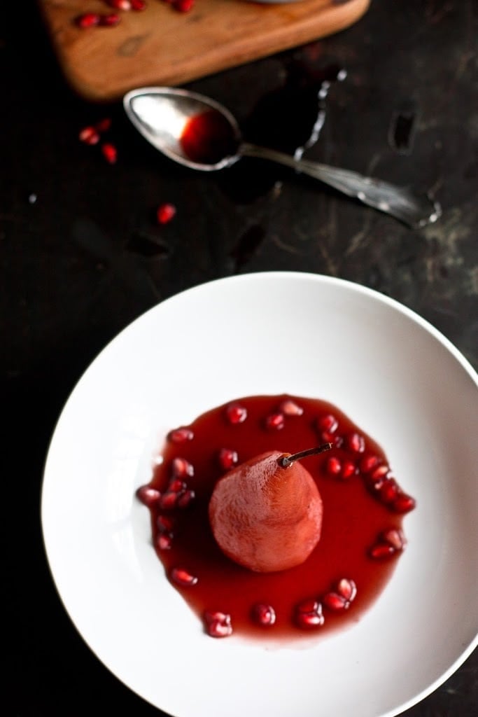 poached pears Poached pears get a little makeover with red wine, pomegranate seeds &. cardamom. This easy healthy dessert is perfect after a heavy holiday meal and is a snap to make! #poachedpears