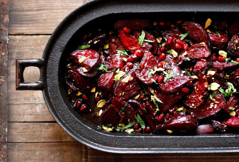 Moroccan Roasted Beets with Pomegranate Seeds, toasted pistachios and a balsamic glaze. A simple, healthy vegan side dish. #moroccanbeets #veganside #roastedbeets #cleaneating #plantbased 