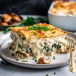A delicious recipe for creamy Chicken Lasagna with mushrooms, spinach and rosemary layered with a creamy bechamel sauce. Vegetarian-adaptable. See notes for making ahead. 