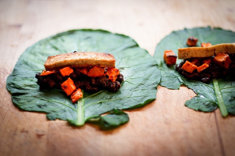 Healthy Vegan Collard Green Wraps - served up burrito-style with roasted sweet potatoes, tofu, chipotle black beans, avocado and a delicious Chipotle Lime dressing. Vegan and Gluten free! #collardgreens #collardgreenwraps #collardgreenburritos #veganburrito #glutenfreeburrito