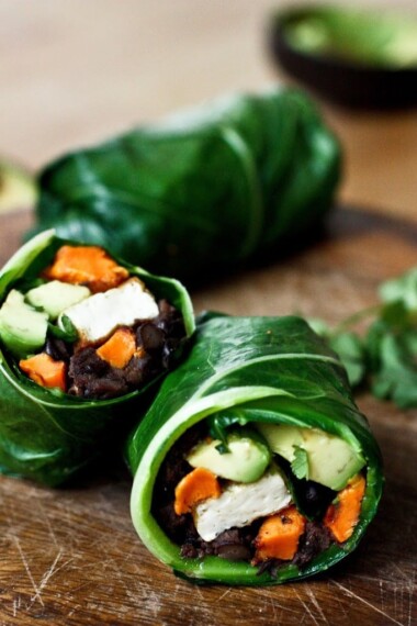 Healthy Vegan Collard Green Wraps - served up burrito-style with roasted sweet potatoes, tofu,  chipotle black beans, avocado and a delicious Chipotle Lime dressing. Vegan and Gluten free! #collardgreens #collardgreenwraps #collardgreenburritos #veganburrito #glutenfreeburrito