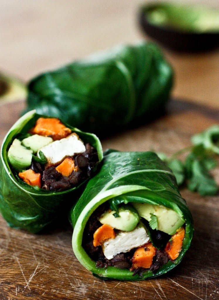 Healthy Vegan Collard Green Wraps - served up burrito-style with roasted sweet potatoes, tofu,  chipotle black beans, avocado and a delicious Chipotle Lime dressing. Vegan and Gluten free! #collardgreens #collardgreenwraps #collardgreenburritos #veganburrito #glutenfreeburrito 