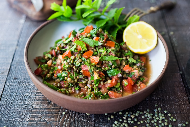 This Simple Lentil Tabouli Salad is full of Middle Eastern flavor! Filling lentils are paired with summer  tomatoes, lemon, mint and parsley and a unique combination of spices, and keeps for several days, perfect for midweek lunches or potlucks! Vegan and Gluten-Free #tabouli #lentil #lentils #lentilsalad #lentiltabouli #lentiltabbouleh #tabbouleh #vegan #salad #glutenfree