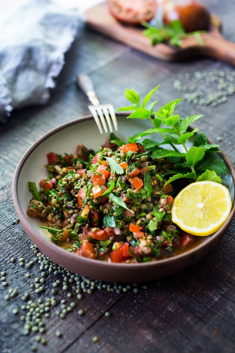 25 Best Lentil Recipes! | This Simple Lentil Tabouli Salad is full of Middle Eastern flavor! Filling lentils are paired with summer tomatoes, lemon, mint and parsley and a unique combination of spices, and keeps for several days, perfect for midweek lunches or potlucks! Vegan and Gluten-Free #tabouli #lentil #lentils #lentilsalad #lentiltabouli #lentiltabbouleh #tabbouleh #vegan #salad #glutenfree